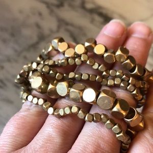 Five stretchy bracelets matte gold metal
